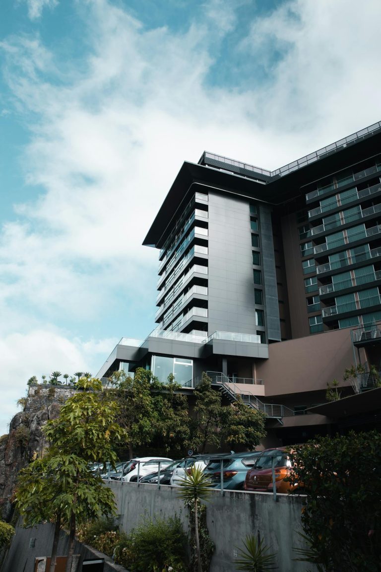 A hotel with a large building on top of a hill